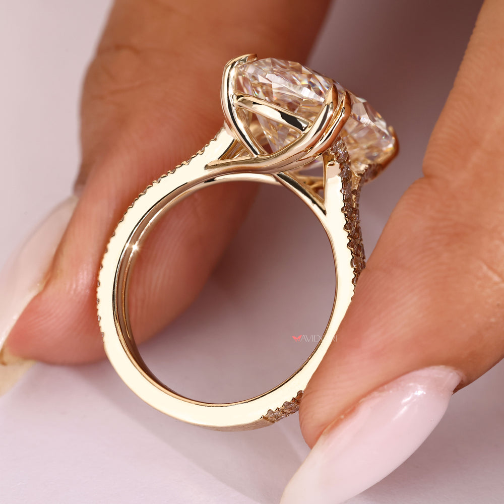 Handmade oval diamond ring with cathedral setting.
