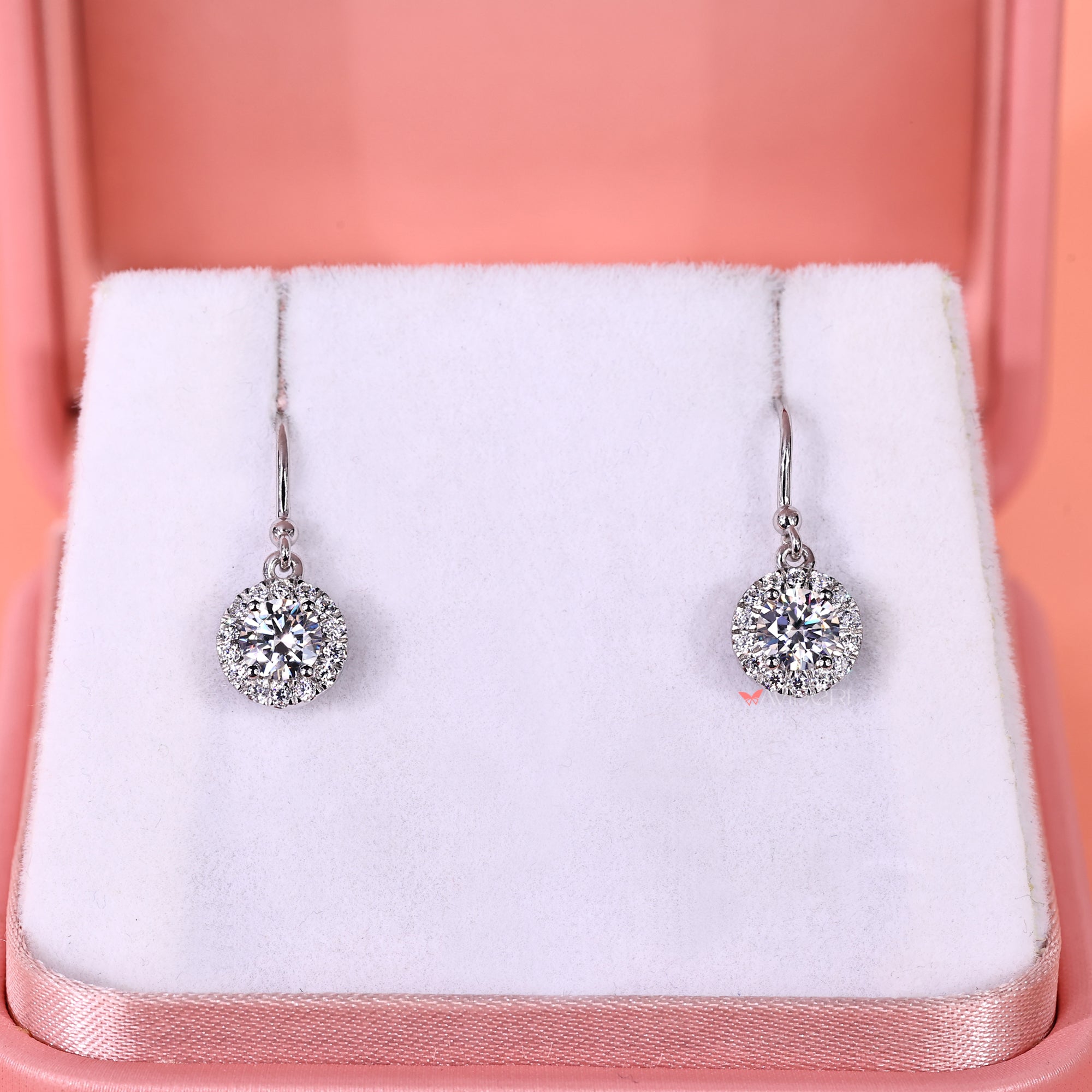 Handmade earrings with round diamonds set in white gold.