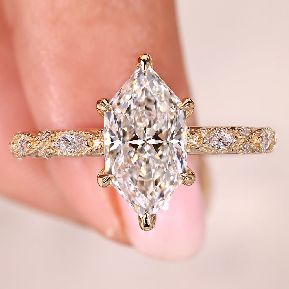 Dutch marquise engagement ring with marquise and round side stone.