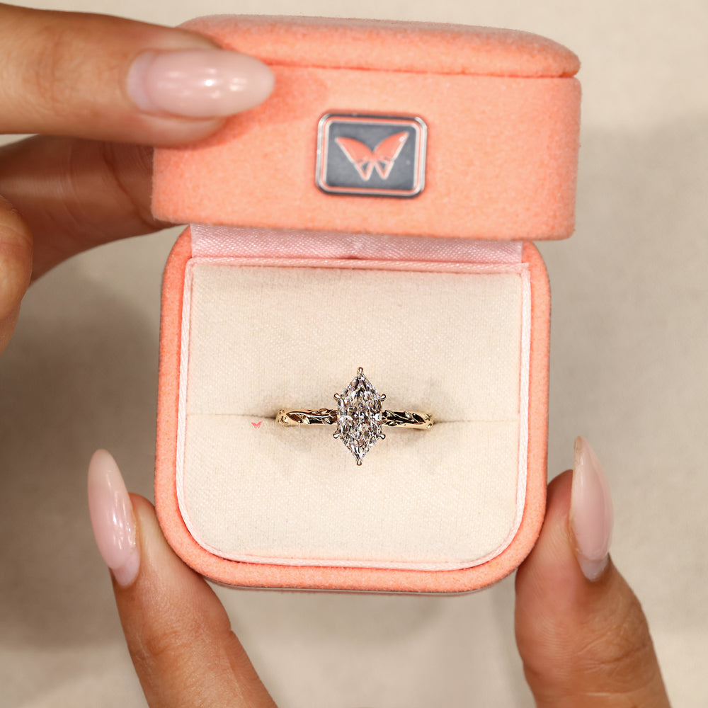 Nature inspired marquise ring with butterfly detail.
