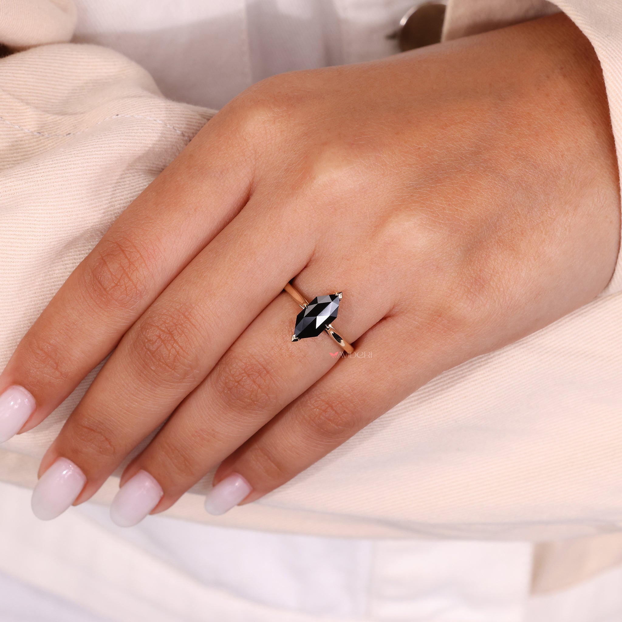 A rose cut engagement ring with a sleek tapered shank.
