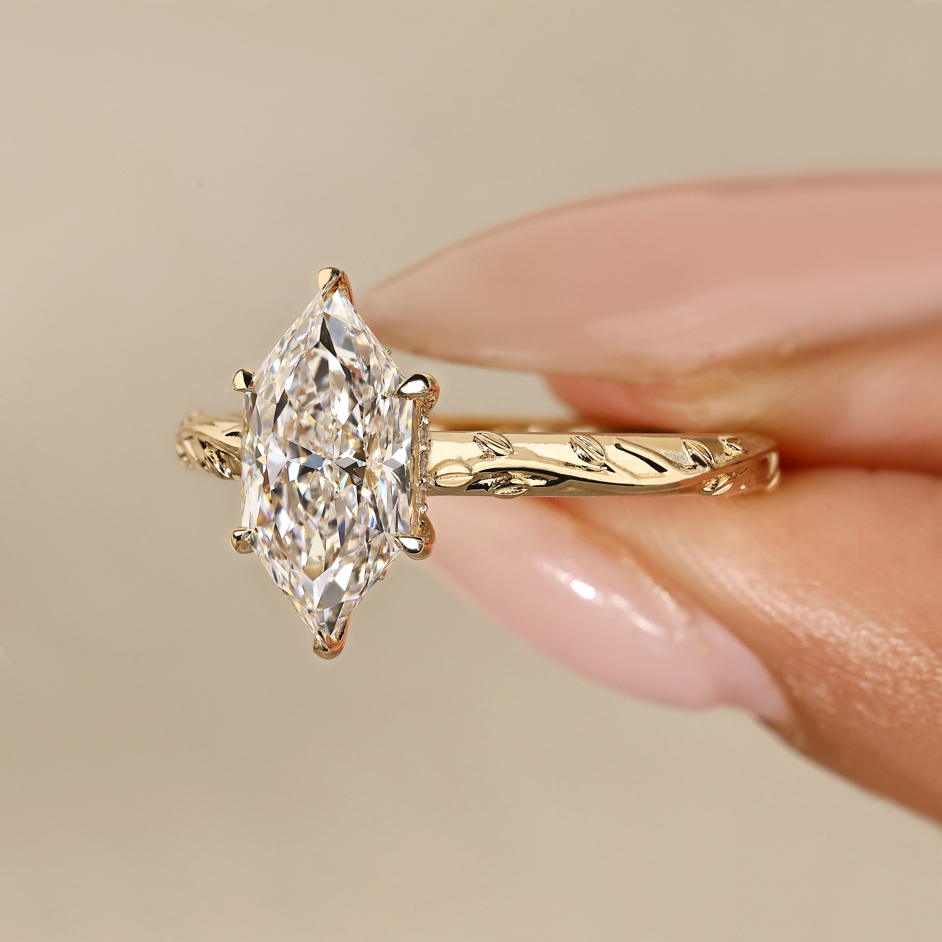 Marquise ring with hidden round diamond halo.
