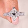 Dutch marquise ring with trapezoid side stone.