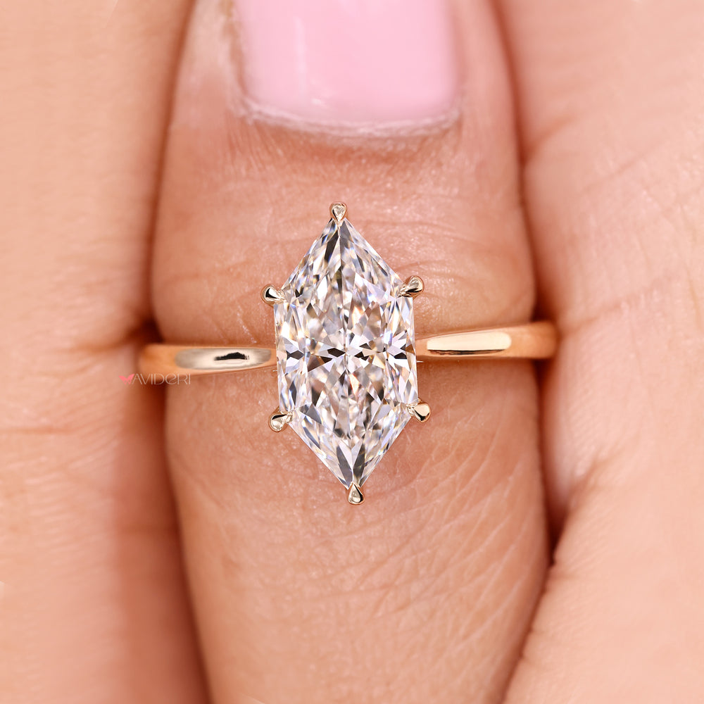 Dutch marquise diamond ring with round halo accents.
