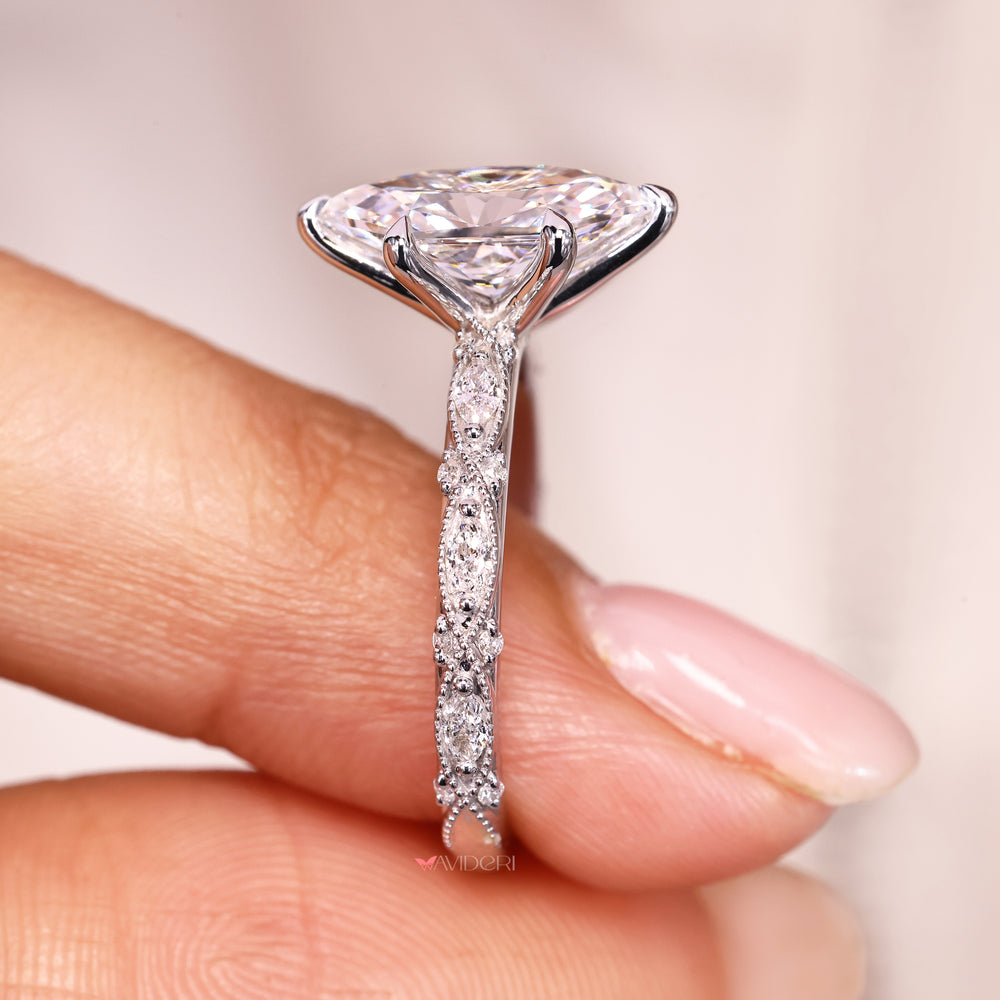 IGI certified dutch marquise diamond ring with claw prongs.
