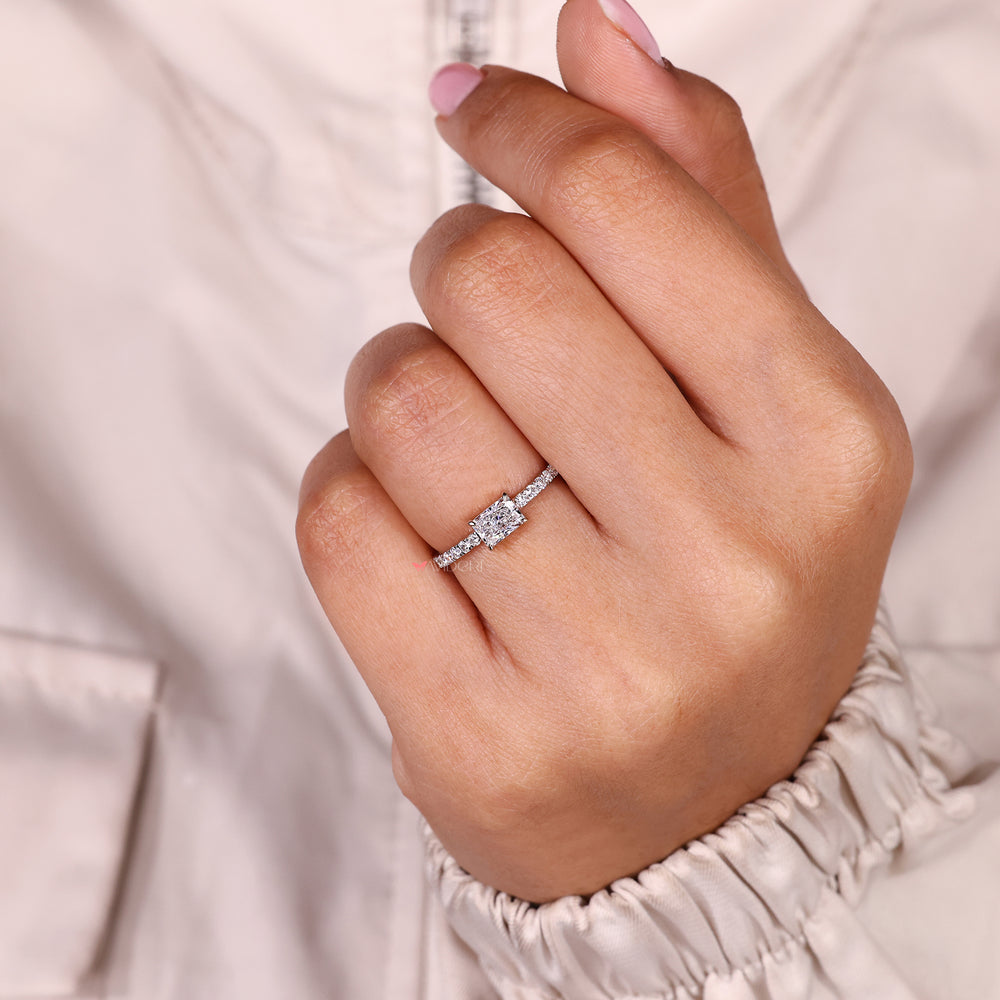 Radiant cut diamond ring with modern pave band.