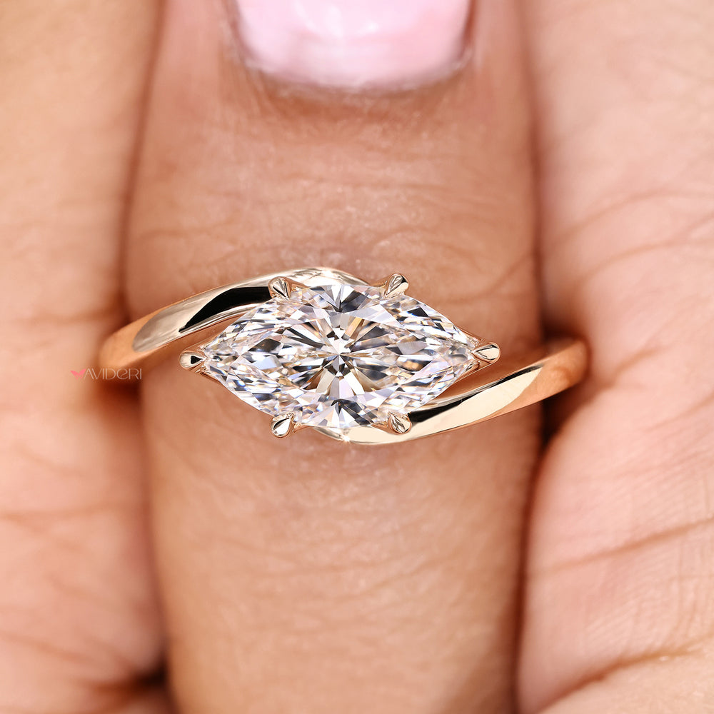 Handmade marquise diamond ring with east to west design
