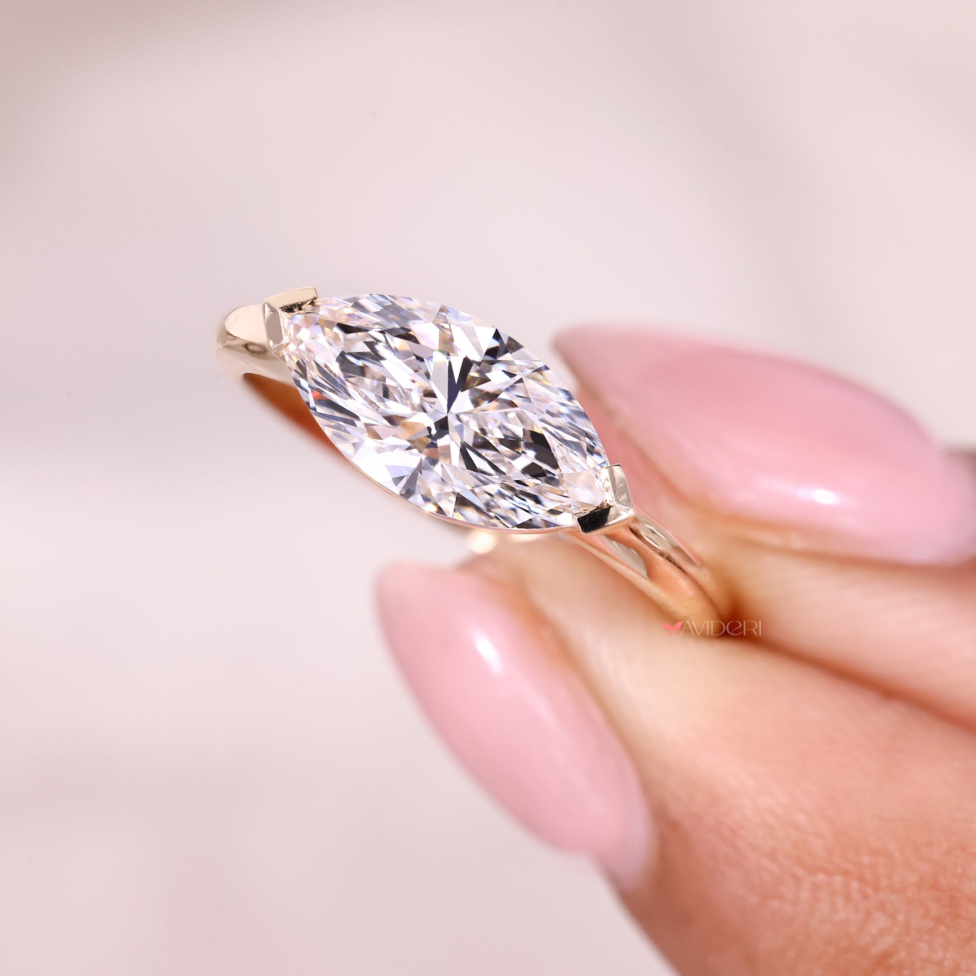 East to west setting ring with v prong setting.