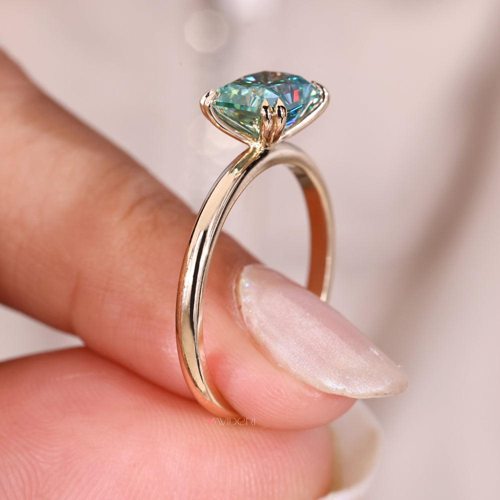 Solitaire moissanite ring with radiant cut gemstone.
