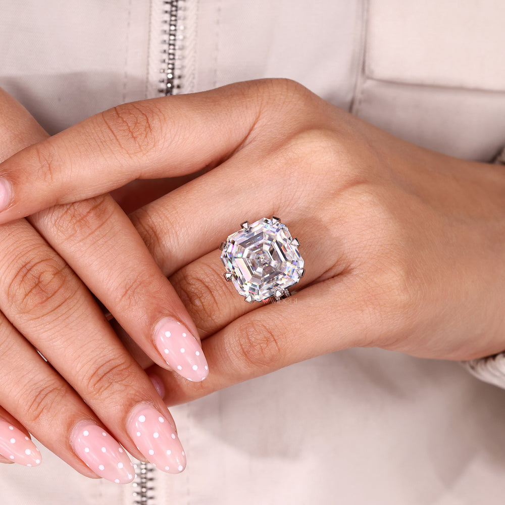 Asscher cut moissanite ring with hidden accent stones.