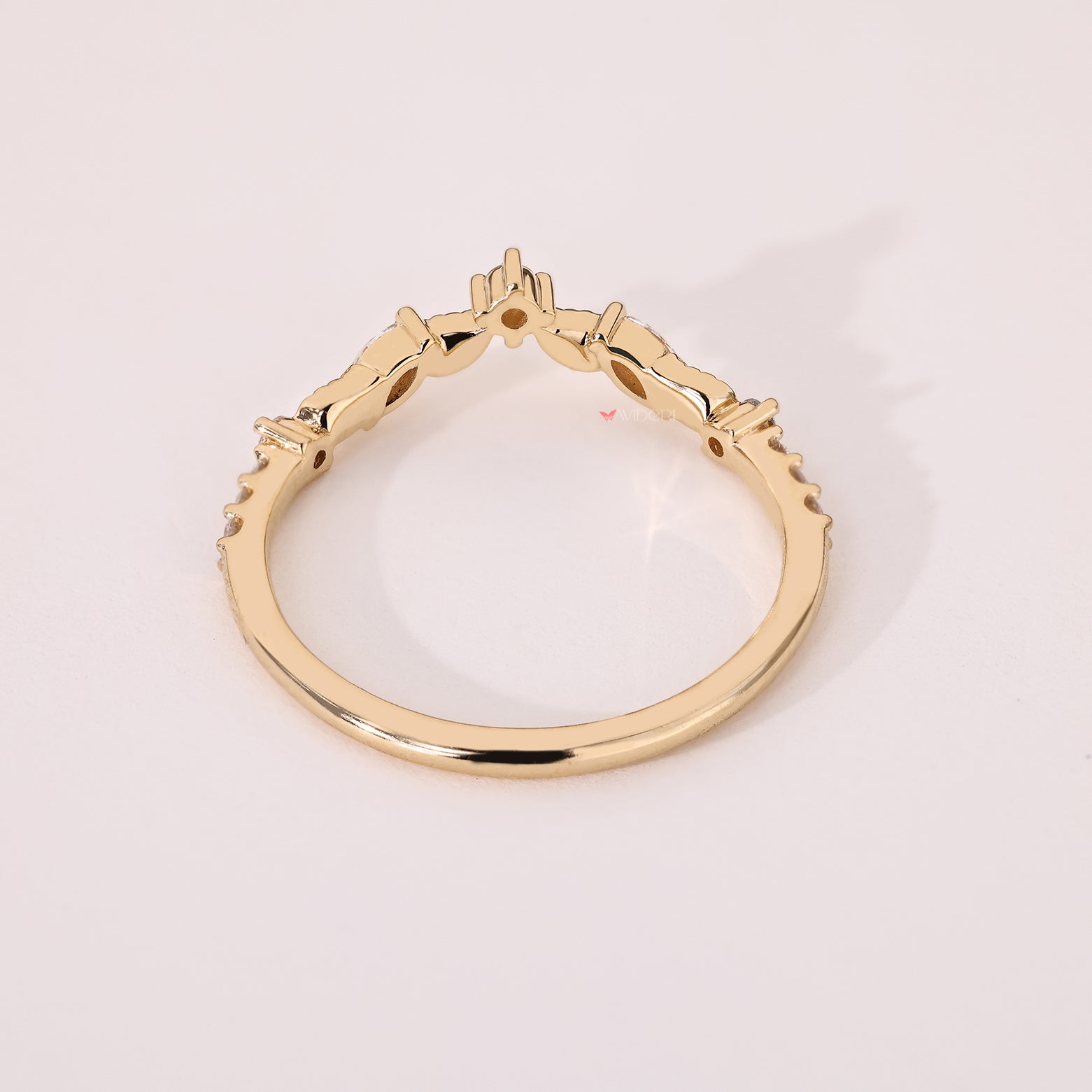 Marquise and round diamond band with curved design details
