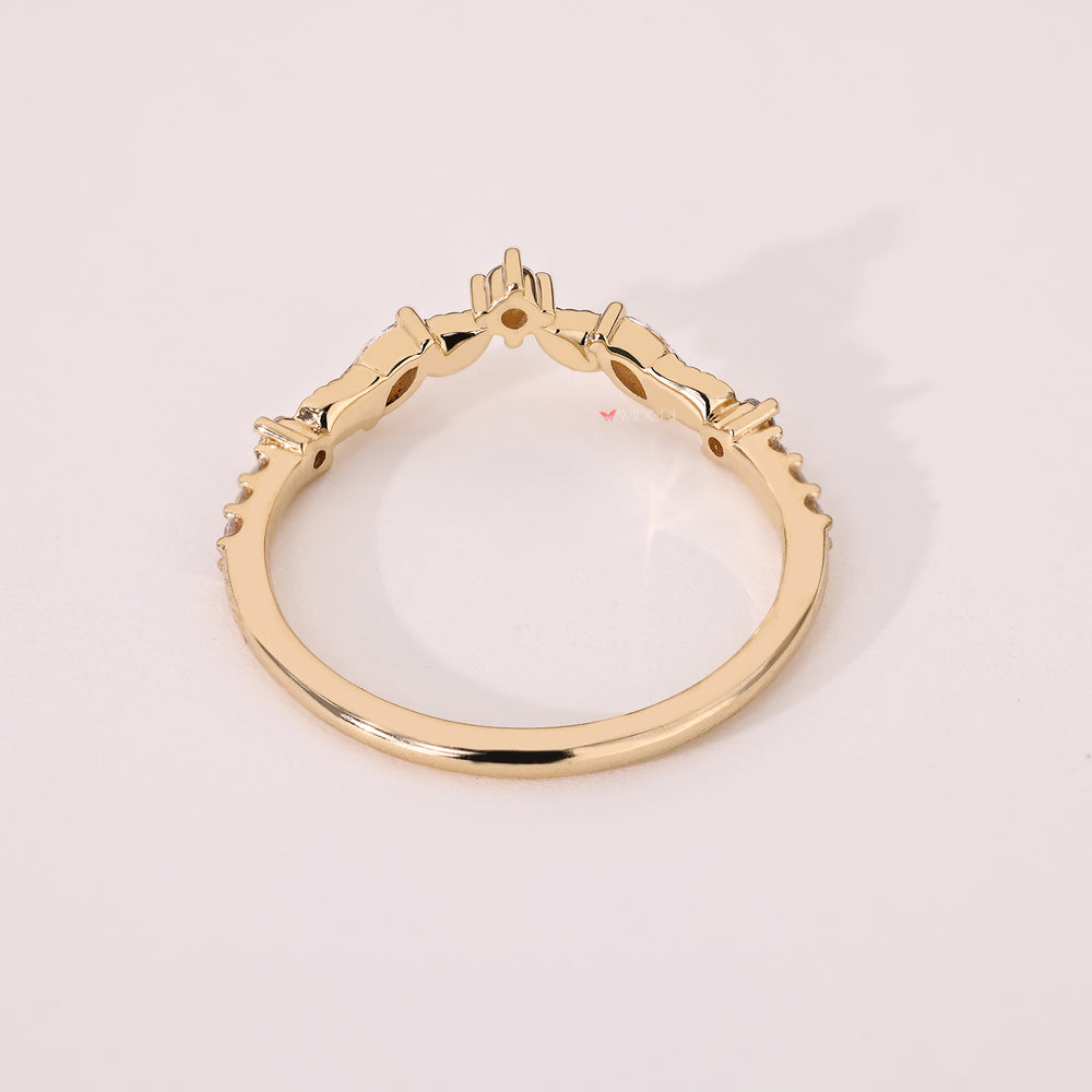 Marquise and round diamond band with curved design details
