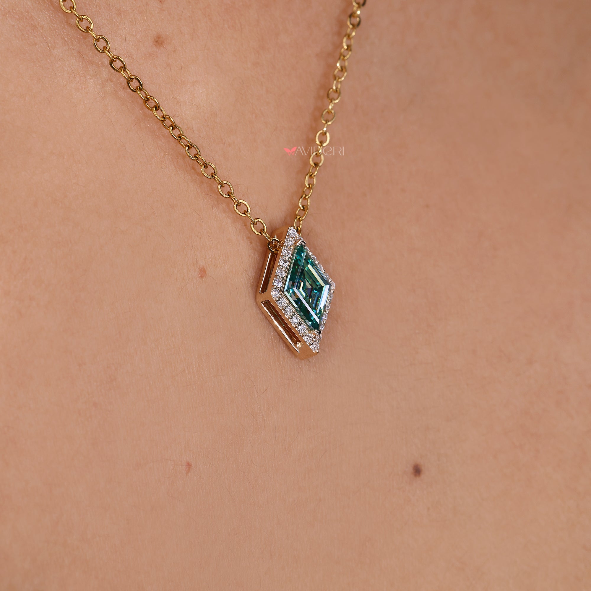 Lozenge cut pendant with sparkling halo.

