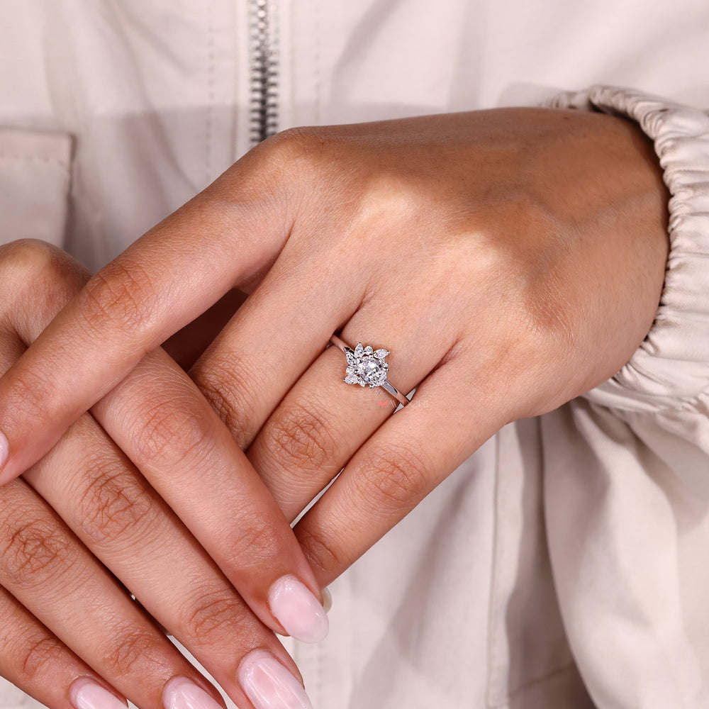 Elegant oval diamond ring with mixed side stones.
