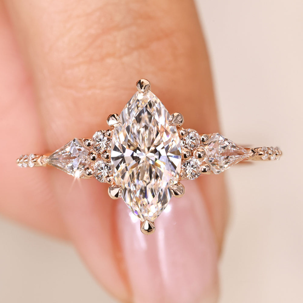 Marquise cut diamond ring with kite side stones.
