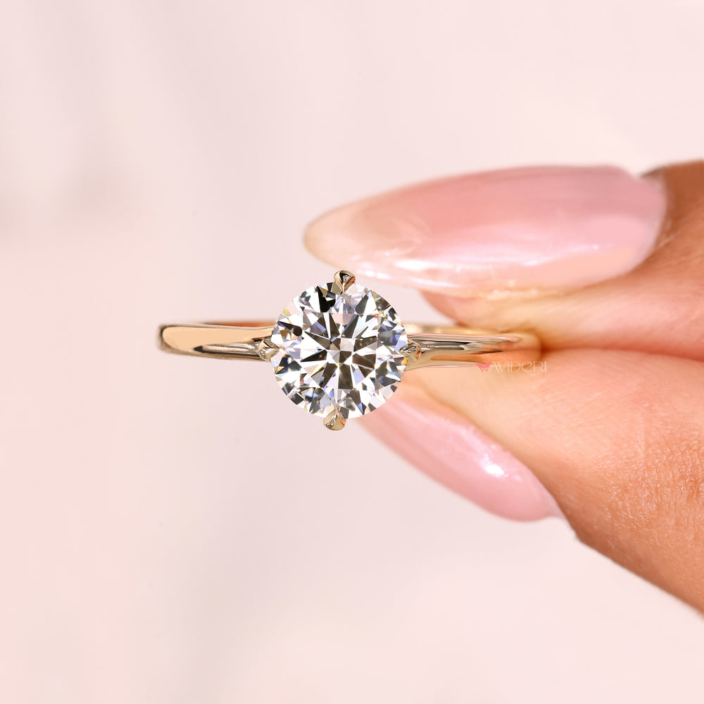 IGI certified solitaire diamond ring with compass claw setting.
