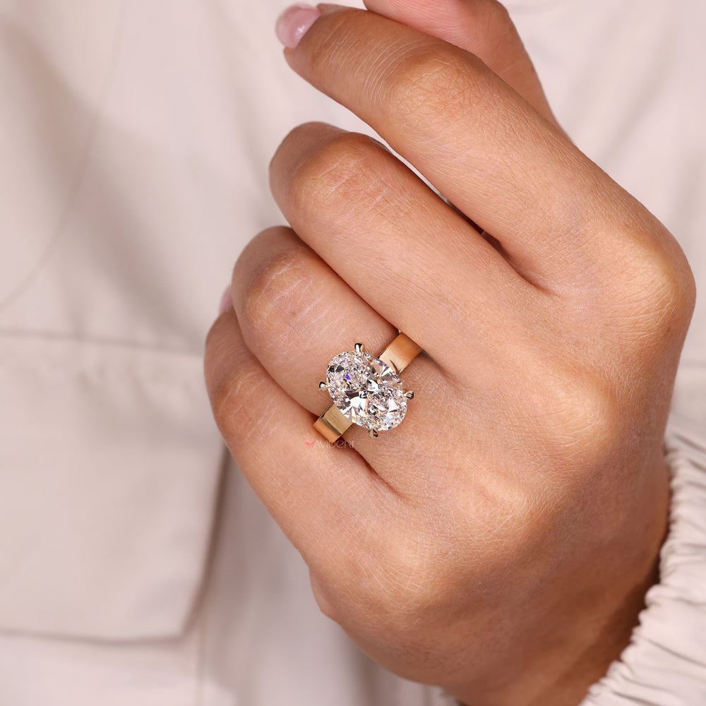 Oval cut ring with hidden halo pave design.
