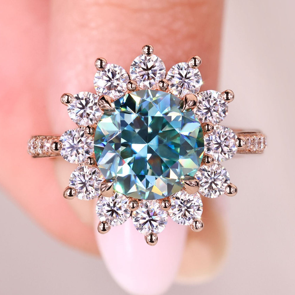 Round moissanite ring with prong and pave setting.
