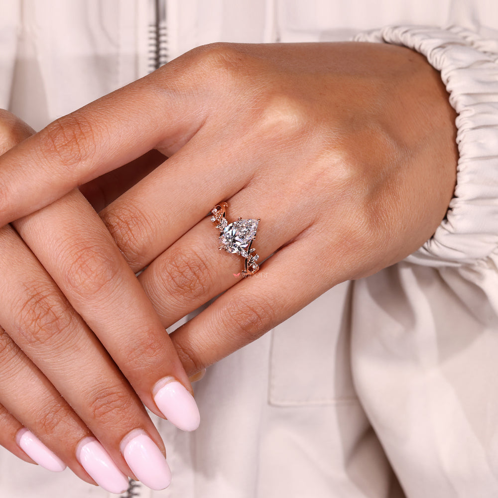 Handmade pear diamond ring with marquise and round stones
