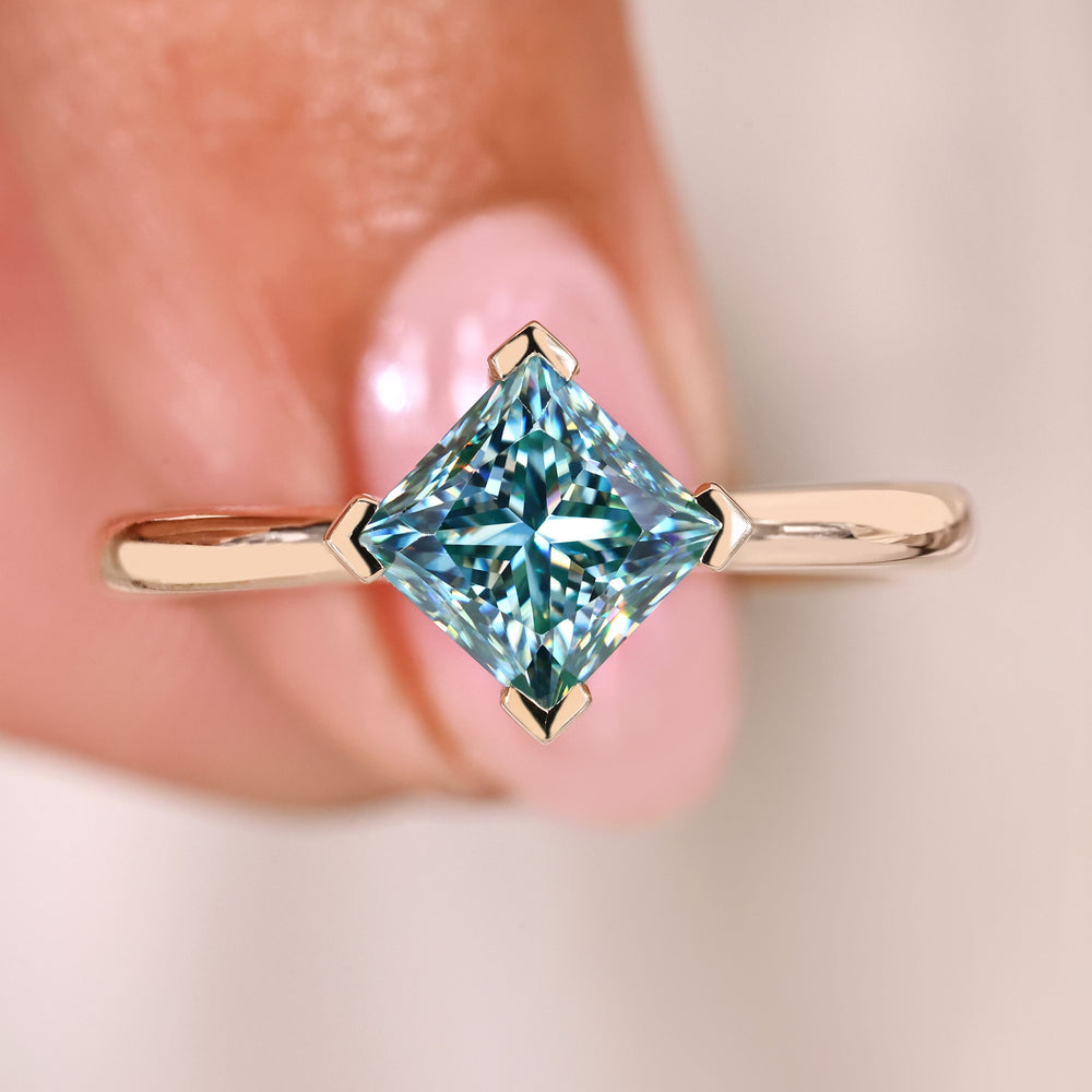 Princess cut moissanite ring cyan blue solitaire.
