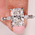 Elongated cushion engagement ring with a bright center diamond.