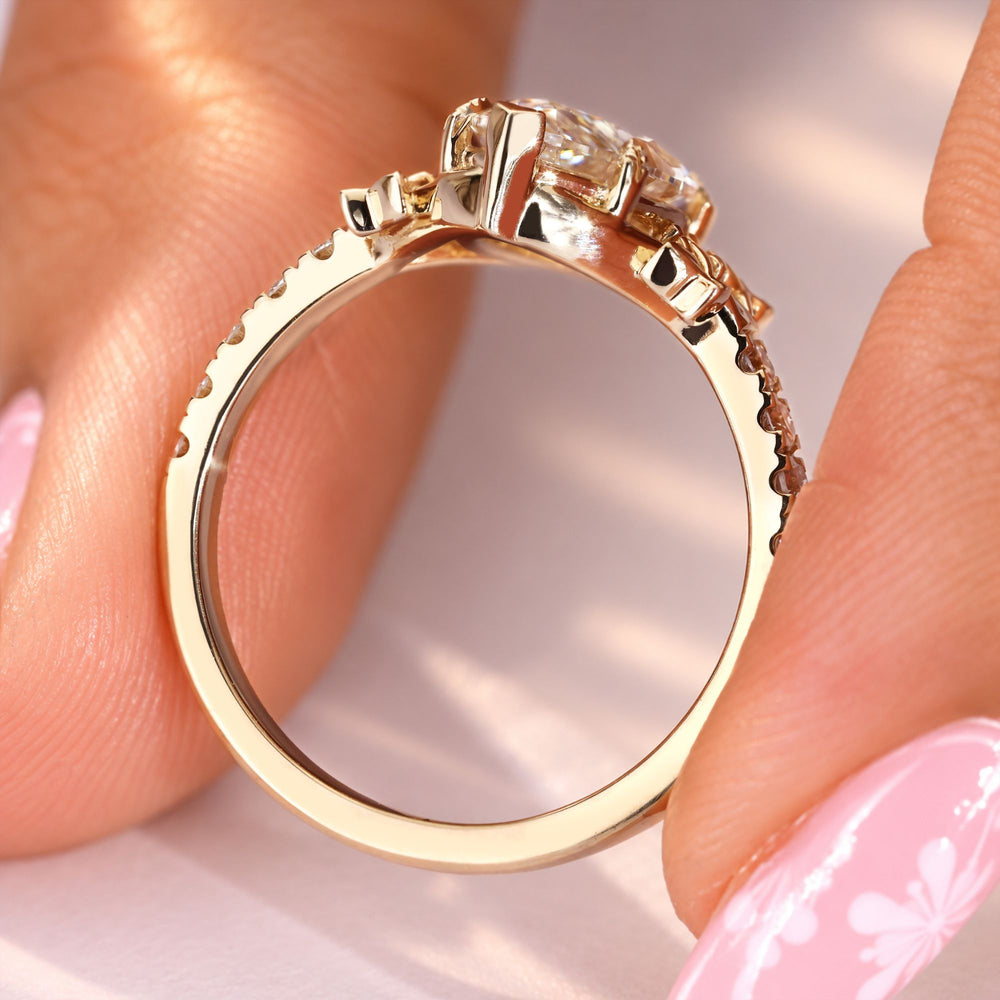 Marquise diamond ring with V and leaf style prongs.
