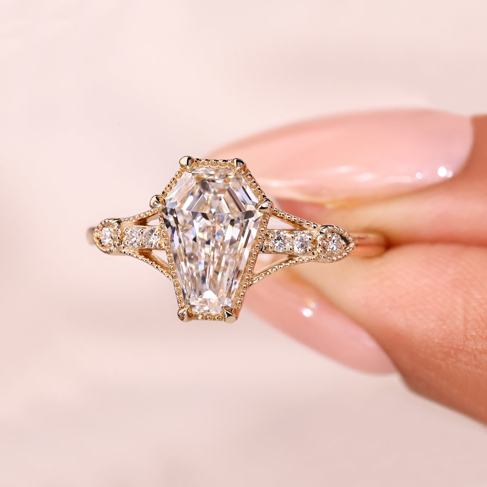 Lab grown shield diamond ring with six prong setting.
