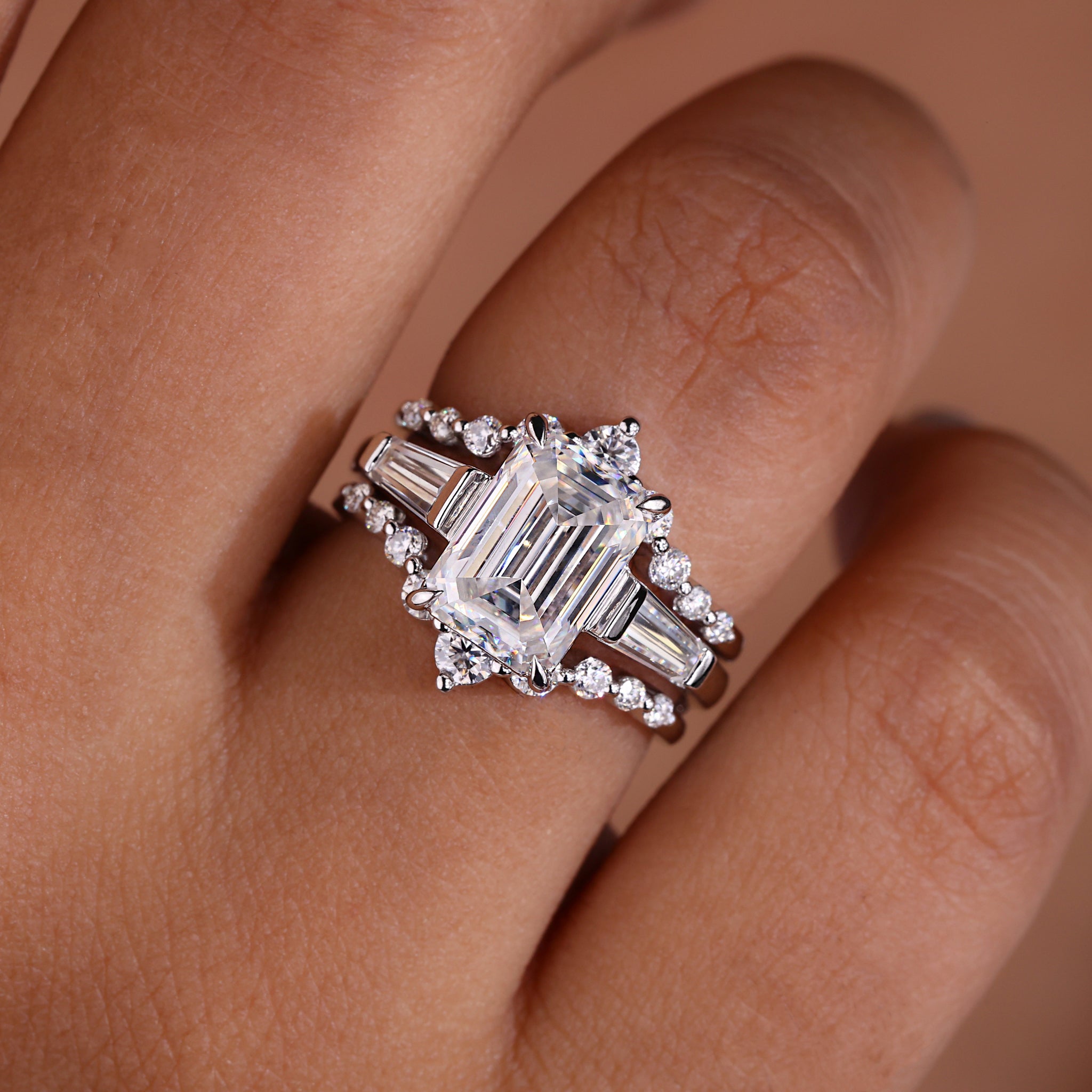 Emerald cut engagement ring with wedding band.