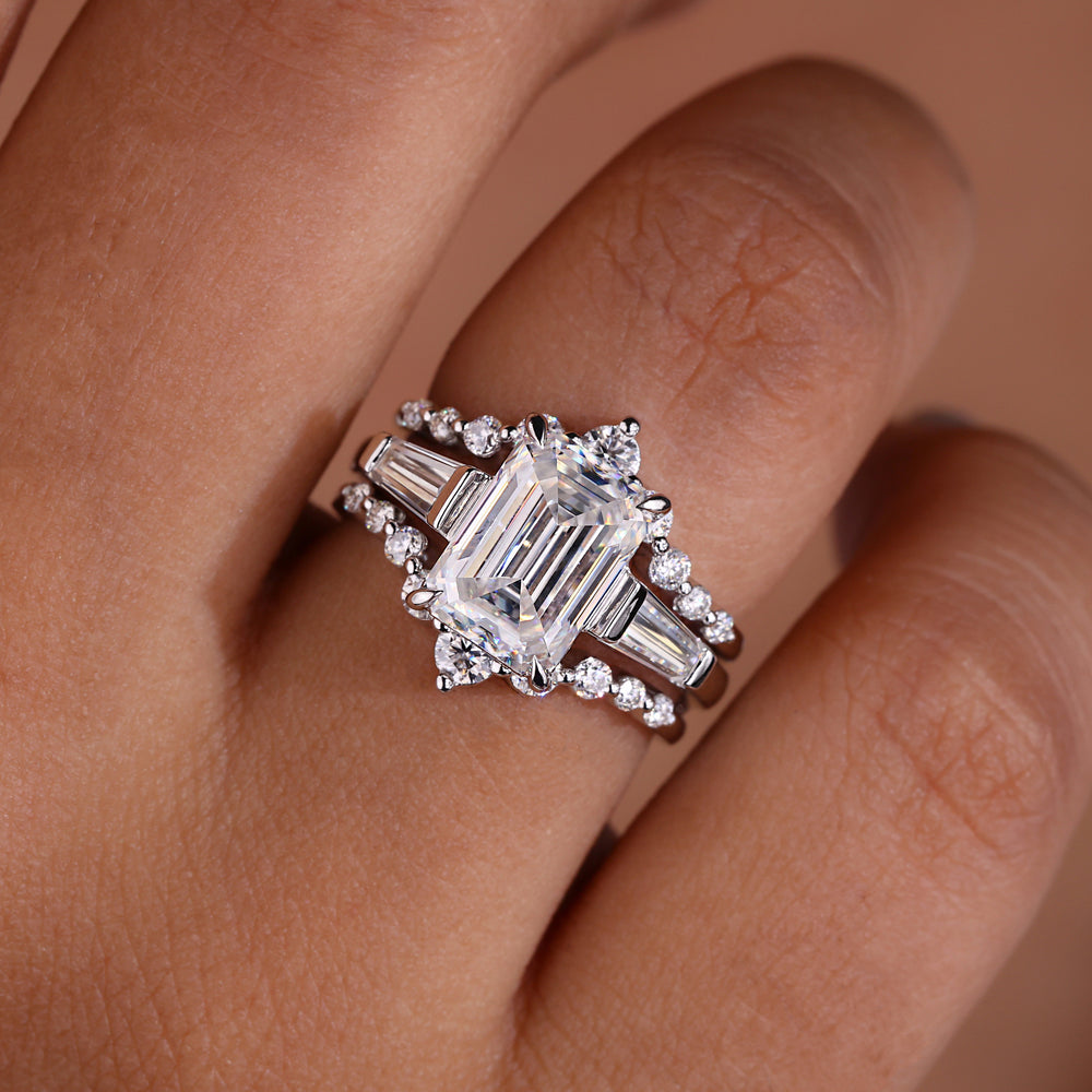 Emerald cut engagement ring with wedding band.