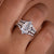 Emerald cut engagement ring with wedding band.