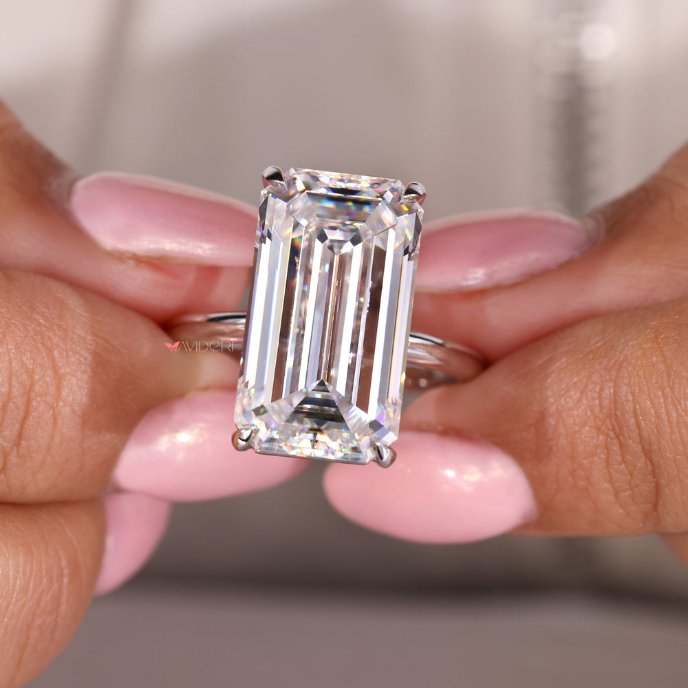 Emerald cut moissanite ring in an elegant solitaire setting.
