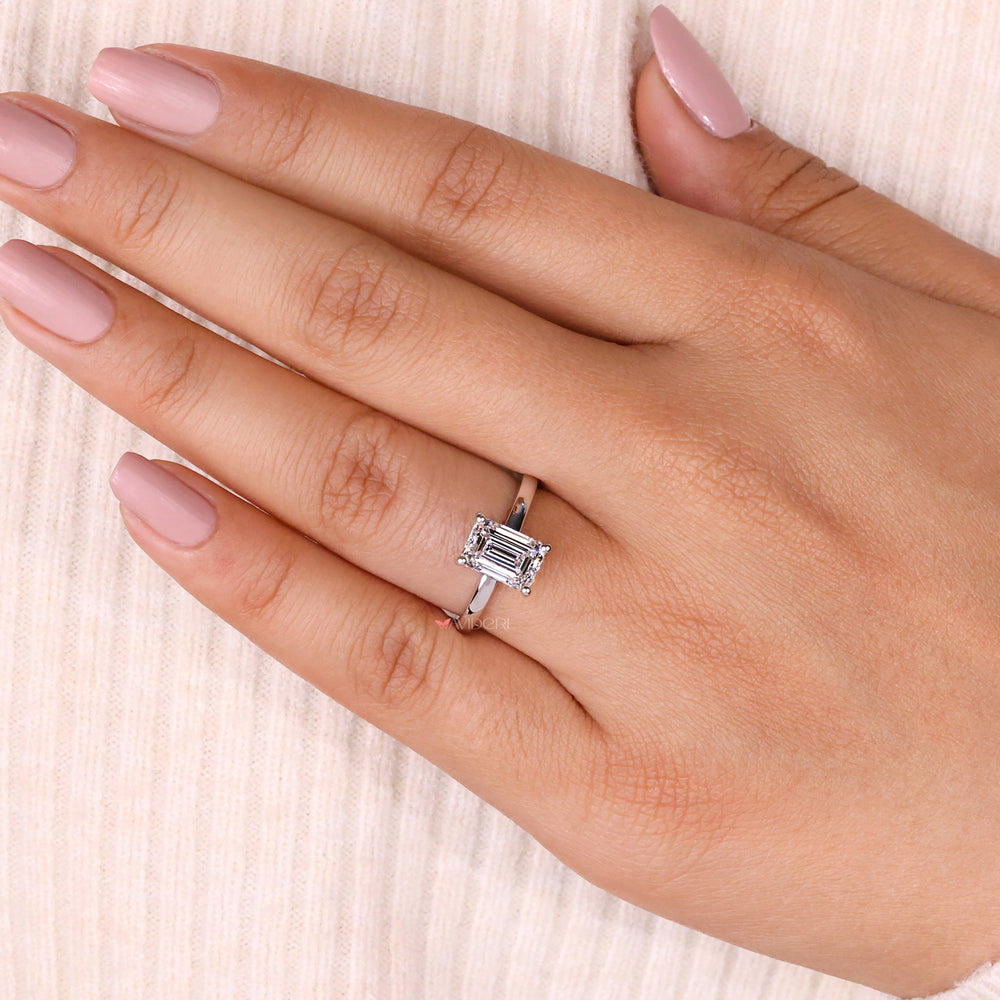Handmade emerald cut ring in yellow gold with exquisite craftsmanship.
