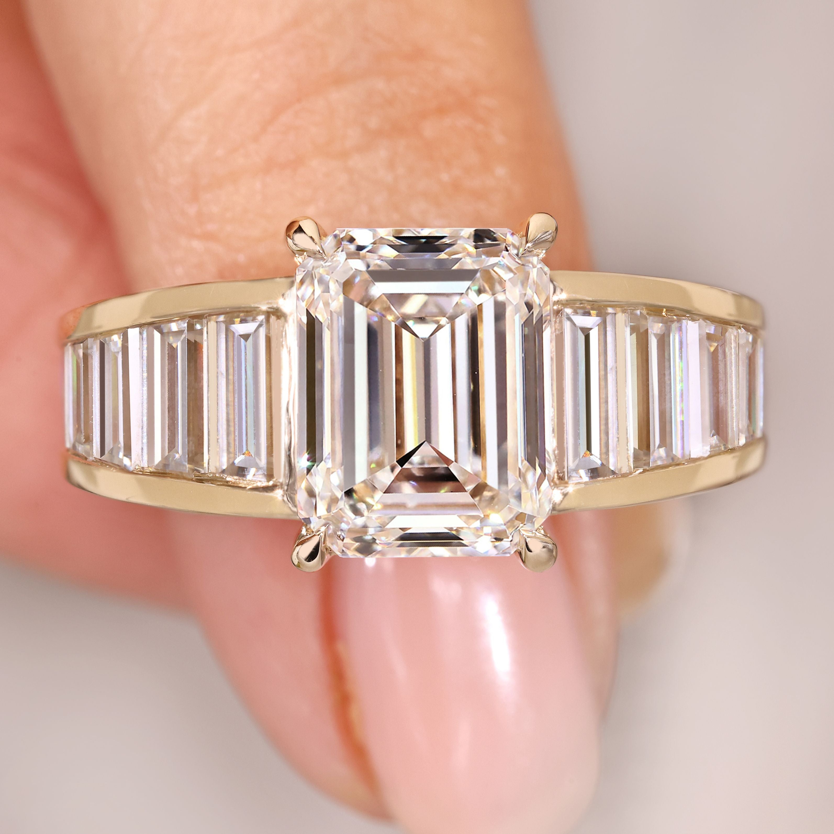 Emerald cut diamond ring with baguette sides.
