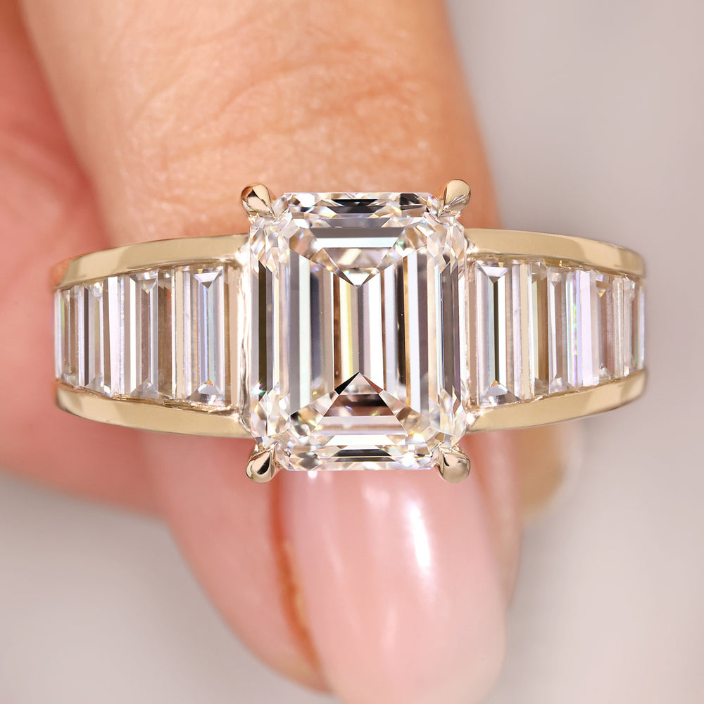 Emerald cut diamond ring with baguette sides.

