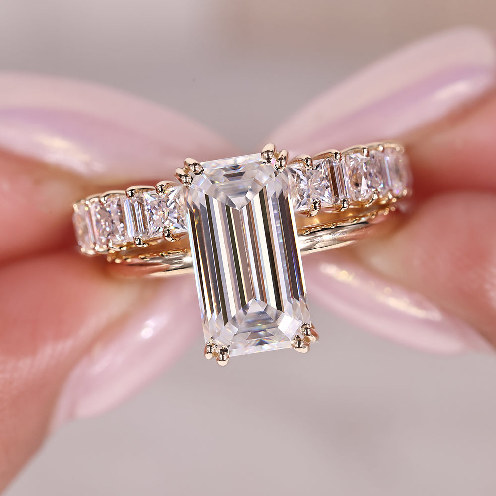 Emerald cut engagement ring with wedding band designed as a cohesive moissanite bridal set.