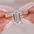 Emerald cut engagement ring with wedding band designed as a cohesive moissanite bridal set.