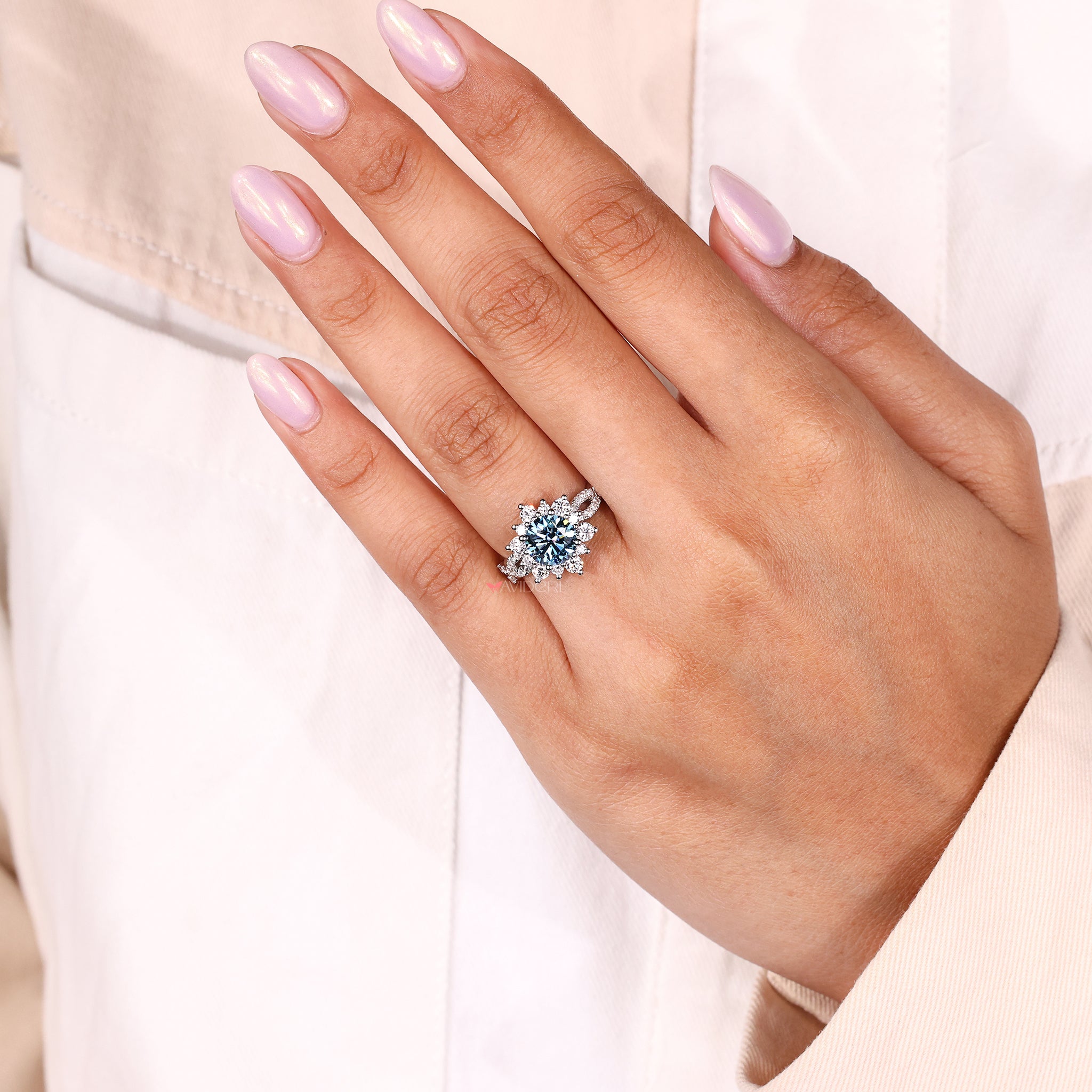 handmade round blue diamond ring with twisted pave band and custom design.
