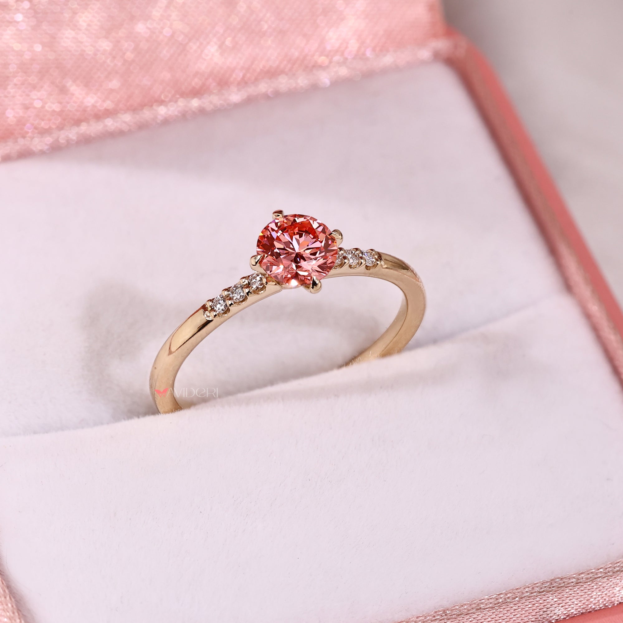 Seven stone pink diamond ring with 4 claw prong yellow gold.