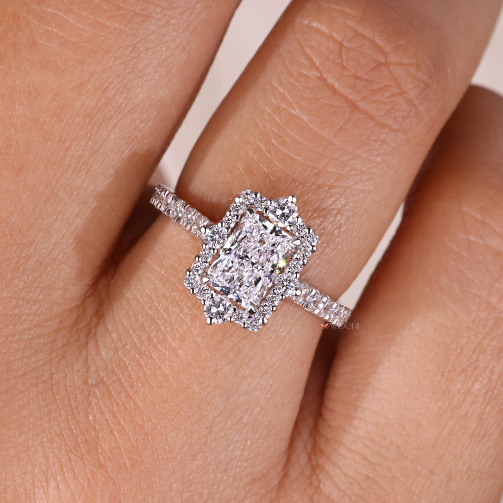 Avideri engagement ring showcasing a bridge accent and pave diamond band.

