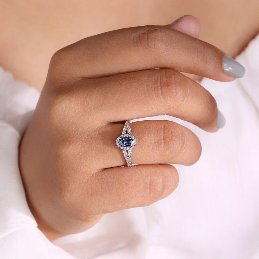 Royal dark blue stone shines brightly in white gold engagement ring.