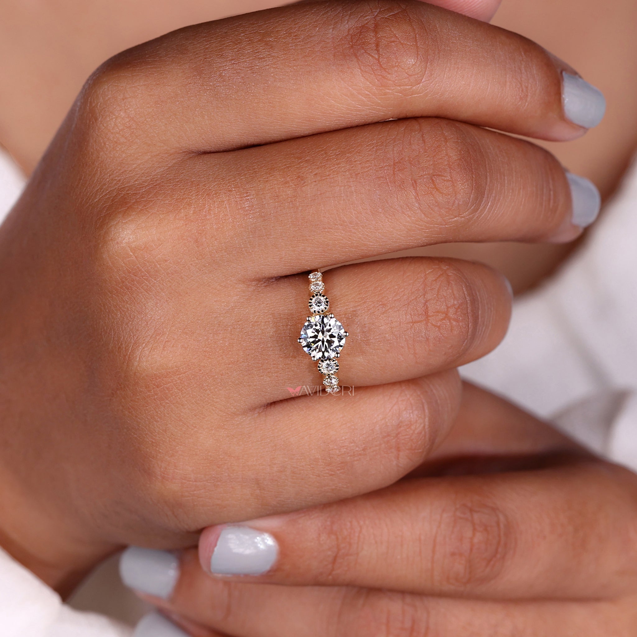 Handmade ring featuring a tapered pave ring style with rounded diamond accents for a timeless look.

