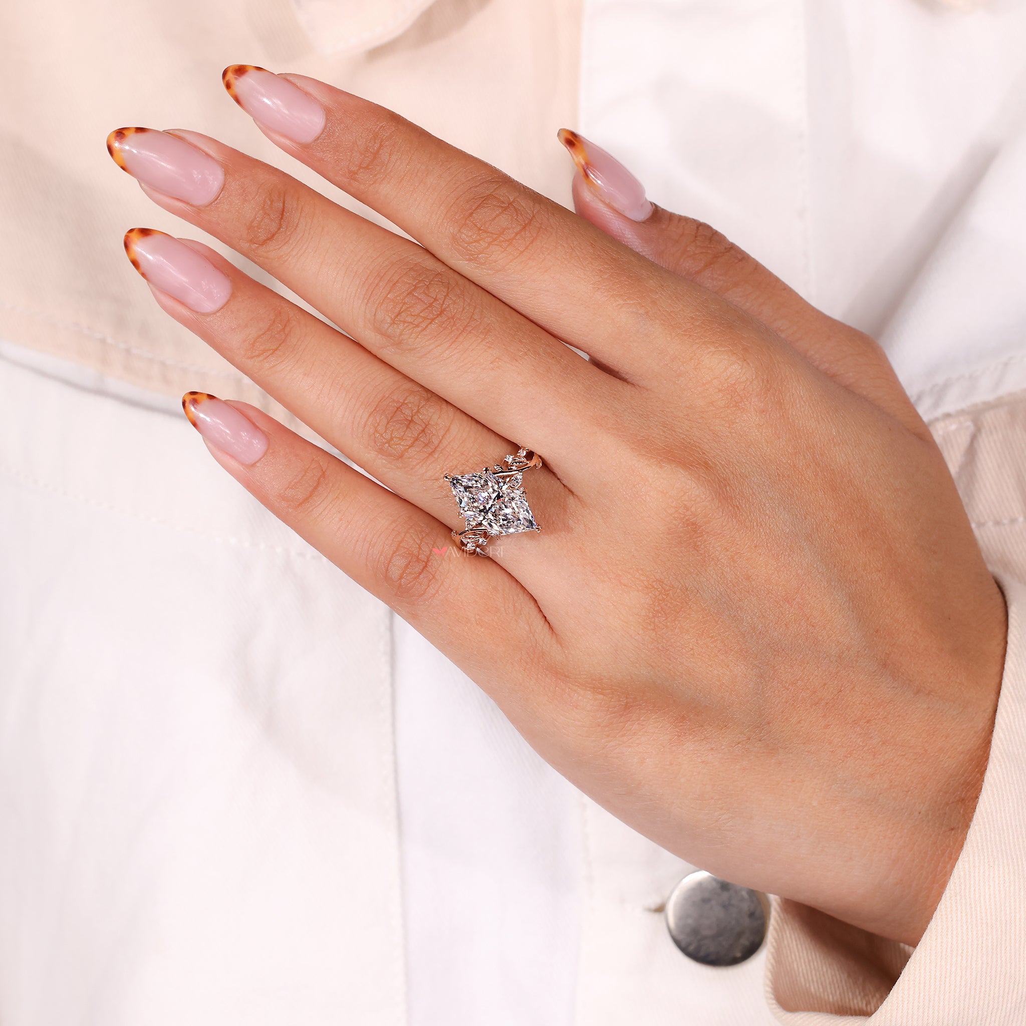 Avideri engagement ring crafted with a Dutch marquise diamond and yellow gold vine and leaf design.
