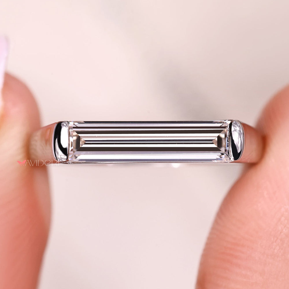 Handmade jewelry ring with baguette diamond detail.