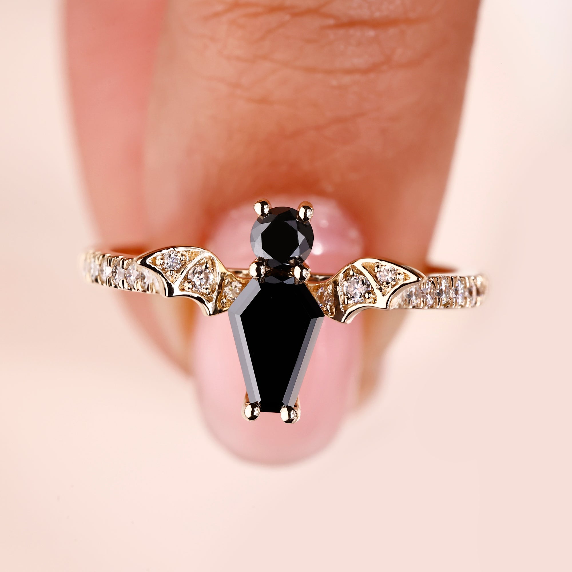Coffin cut engagement ring with black coffin ring.