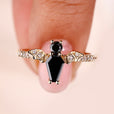 Coffin cut engagement ring with black coffin ring.