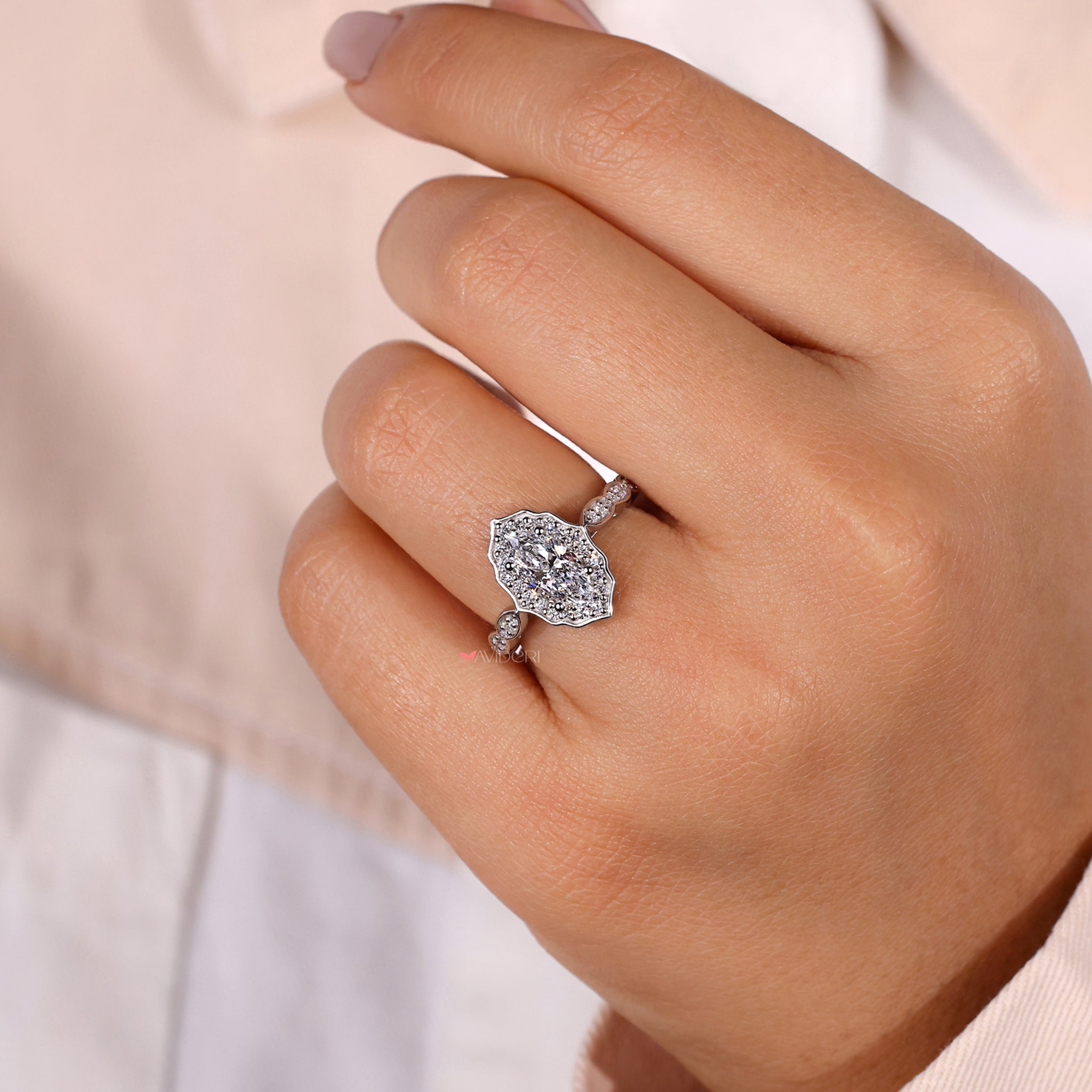 Round diamond ring in a gold engagement ring style.
