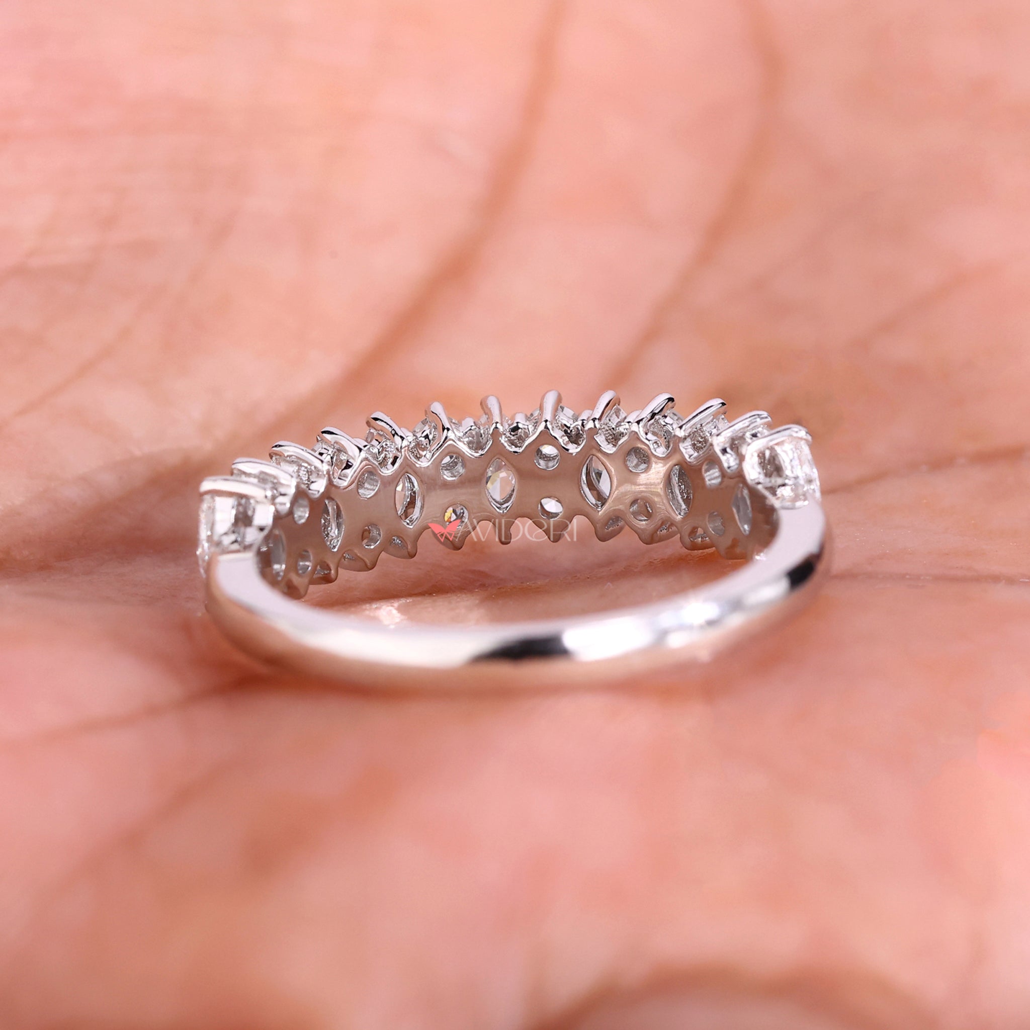 A round diamond wedding band that pairs perfectly with any ring.
