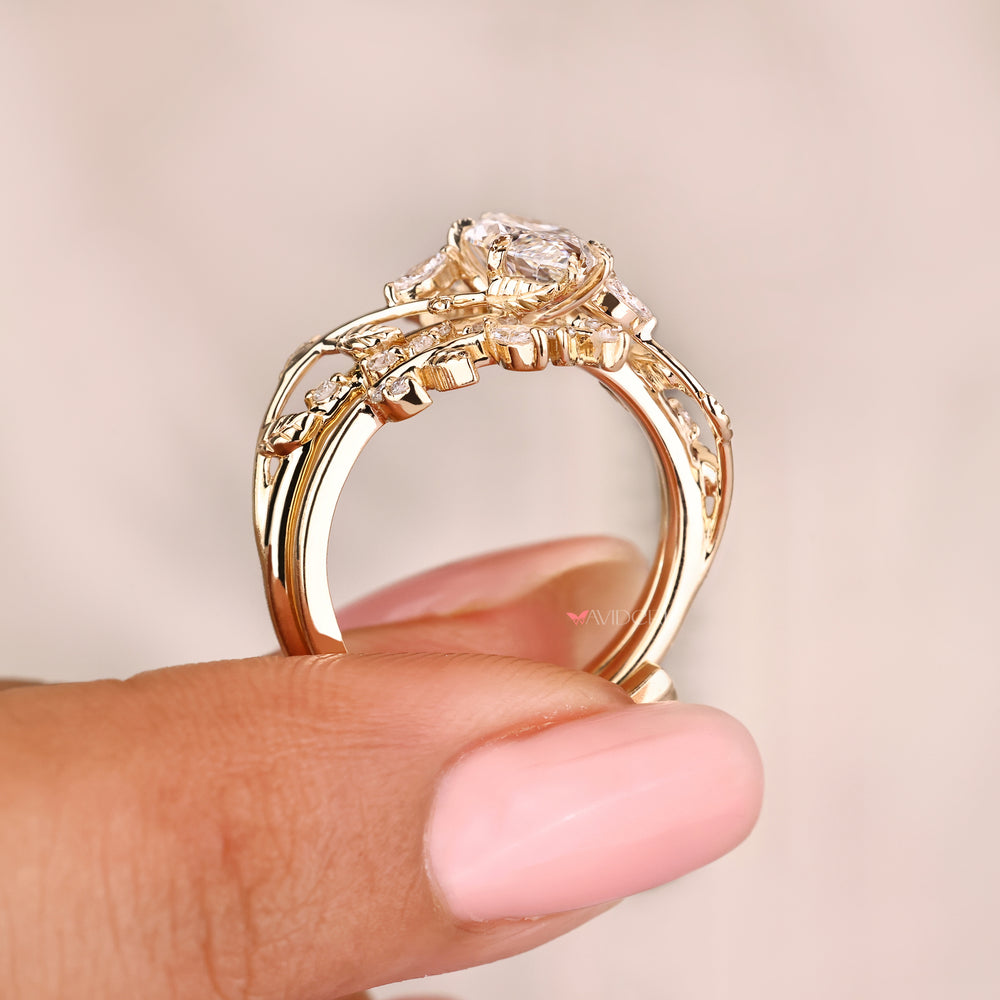 Nature inspired marquise ring with side stones.
