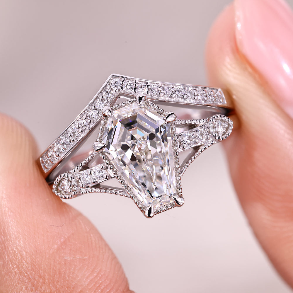 Engagement ring with wedding band in white gold featuring coffin cut center stone.