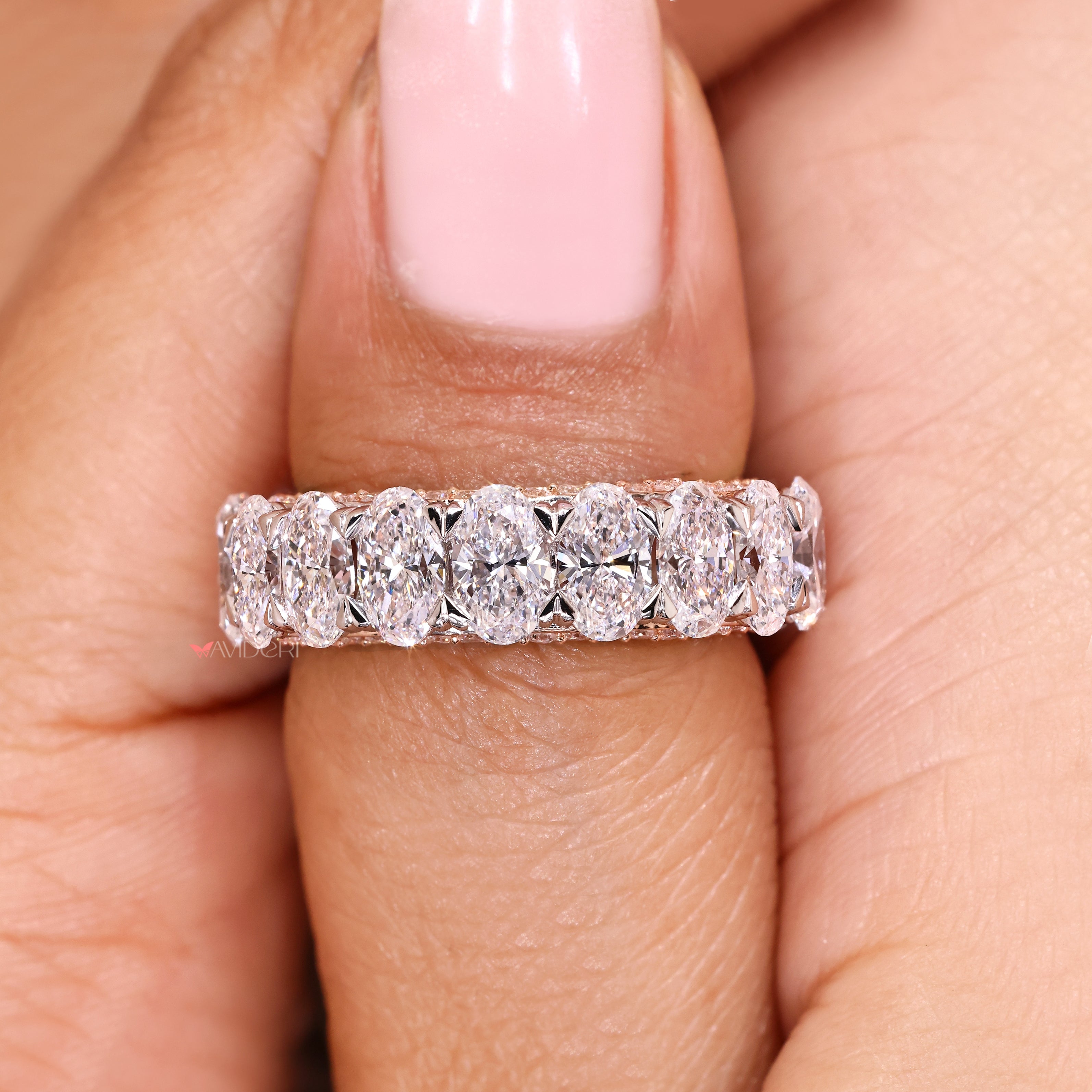 Oval cut band with three row pave diamonds.
